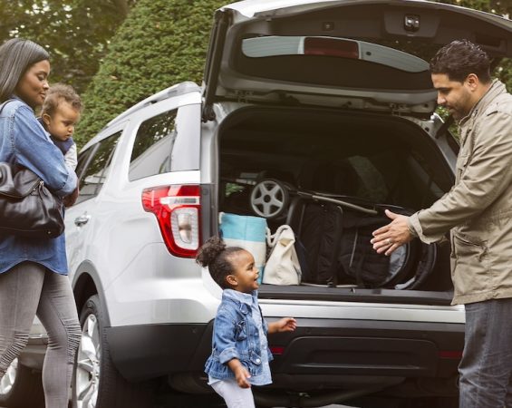 Family packing up a car
